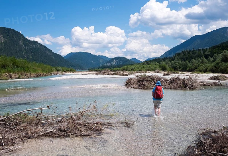 Woman walking in the riverbed of the Isar