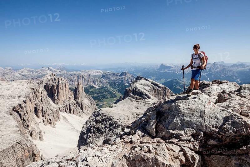 Mountaineer ascending of the Piz Boe on the Vallonsteig in the Sella group