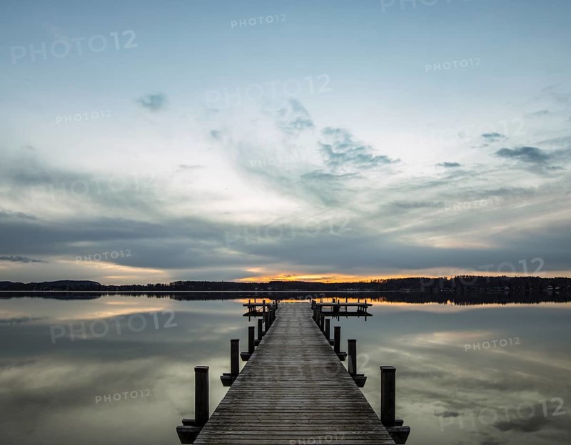 Jetty at sunrise on Worthsee Lake in Inning