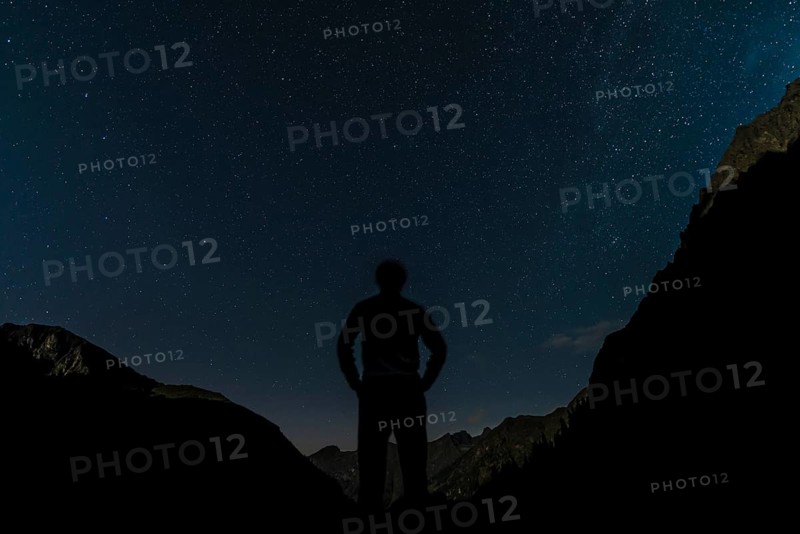 Silhouette of person gazing at the stars