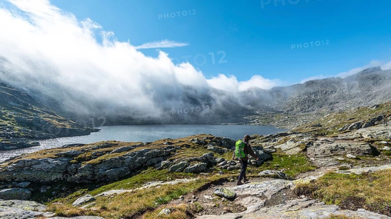 Hiker standing on rock