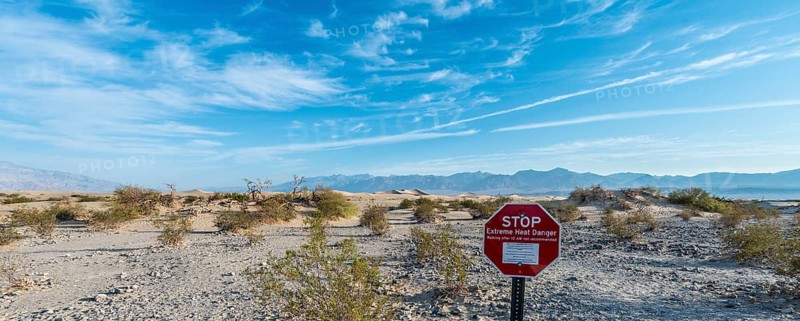 Sign lettering "STOP Extreme Heat Danger" warning of heat