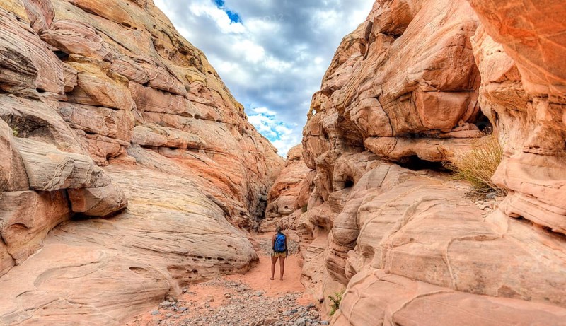 Hiker walking through a canyon