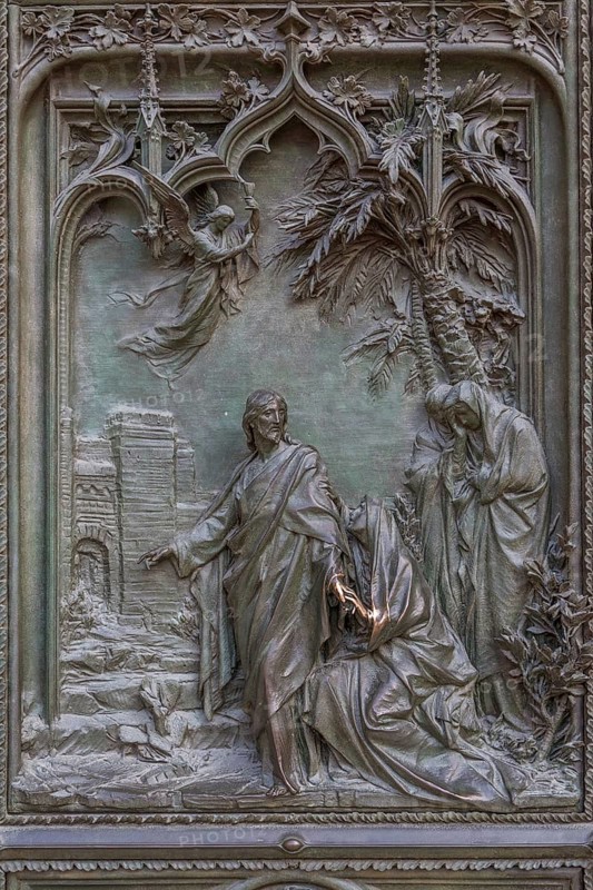 Bronze sculptures at the entrance portal of Milan Cathedral