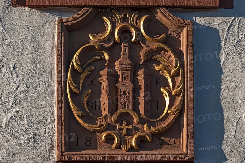 Sandstone relief with the old coat of arms of Ettenheim on a house facade