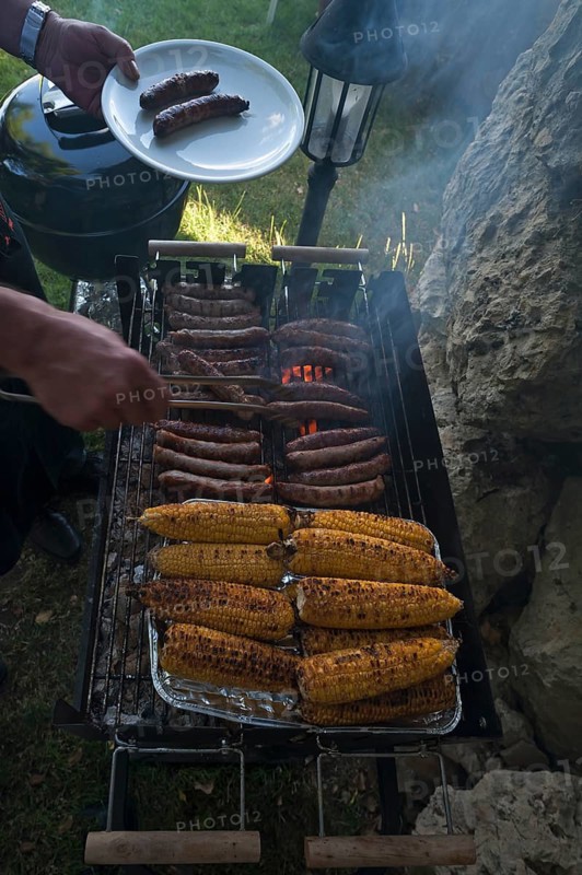 Grill with sausages and corn on the cob