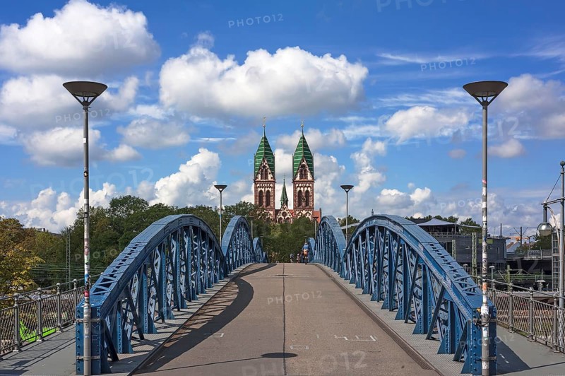 Herz Jesu church behind Wiwilibrucke