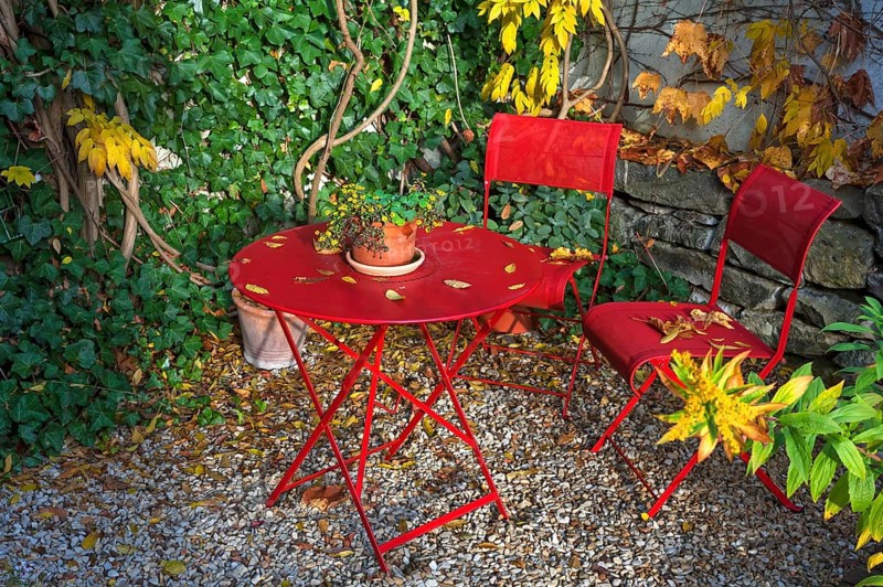 Patio with red garden furniture