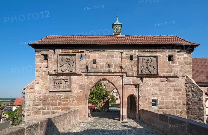Castle gate with two coats of arms