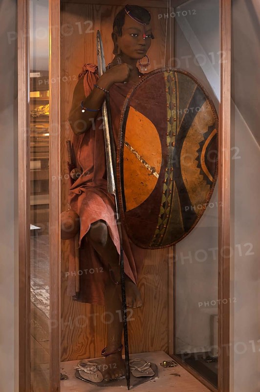 Figure of a Maasai herdswoman from East Africa in a showcase