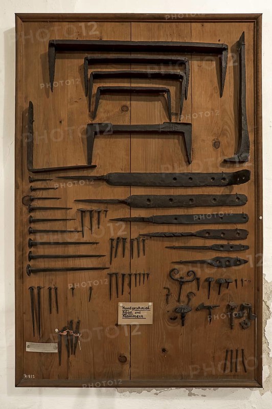 Board with hand-forged nails and staples