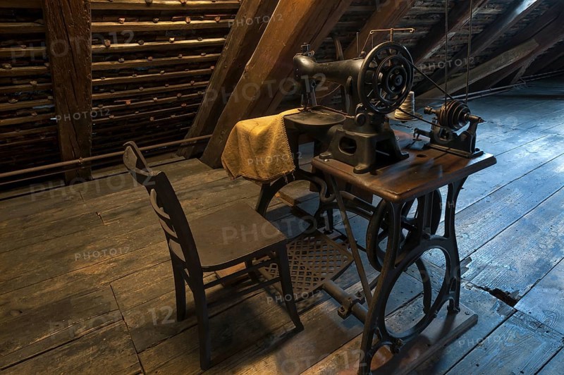 Old sackmaker sewing machine in the attic of a mill