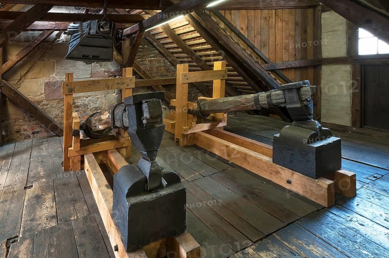 Old blacksmith's hammers and above an old bellow of 1875