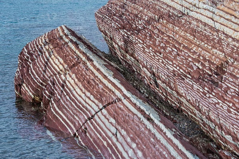 Limestone coloured red by iron and whitish-yellow dolomite