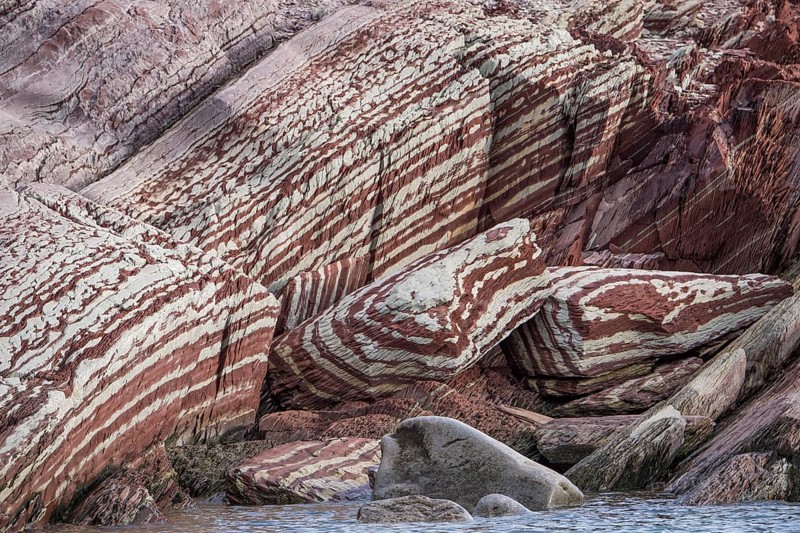 Limestone coloured red by iron and whitish-yellow dolomite