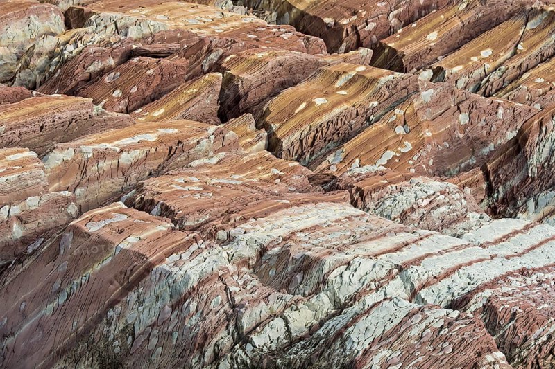 Limestone coloured red by iron and whitish-yellow dolomite