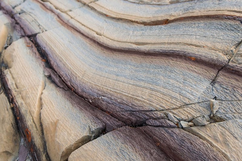 Limestone coloured red by iron and whitish-yellow dolomite