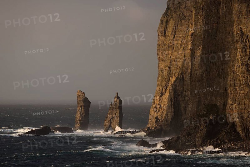 Sea stacks Risin og Kellingin in the evening light