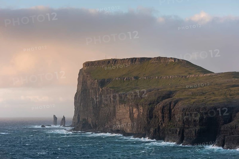 Sea stacks Risin og Kellingin in the evening light