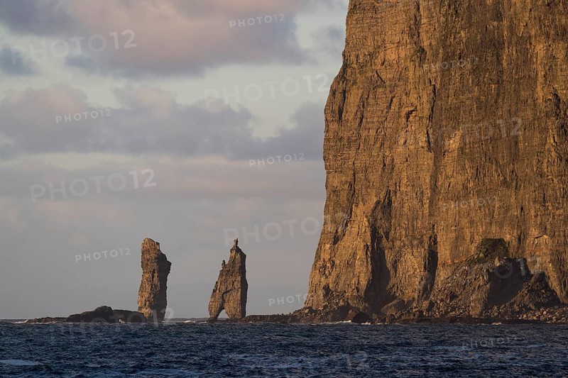 Sea stacks Risin og Kellingin in the evening light