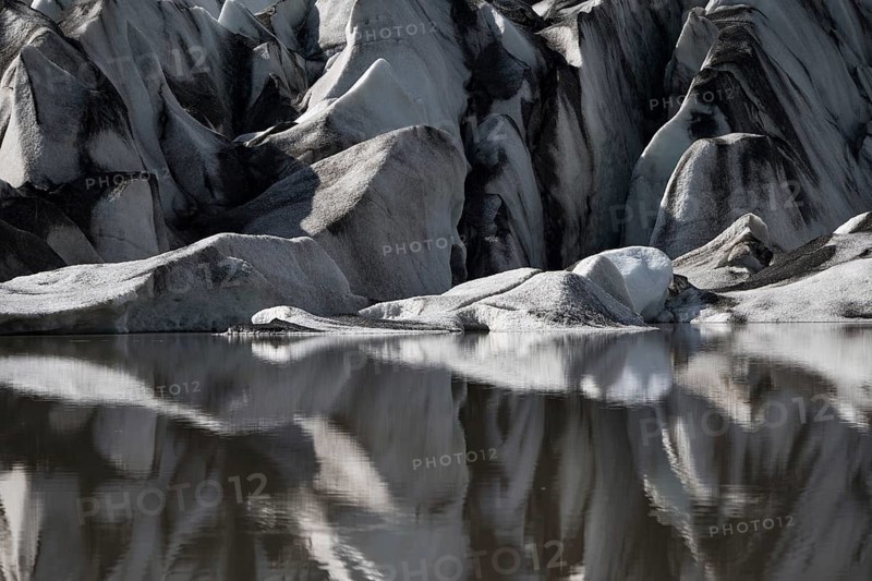 Glacier tongue reflected in the water