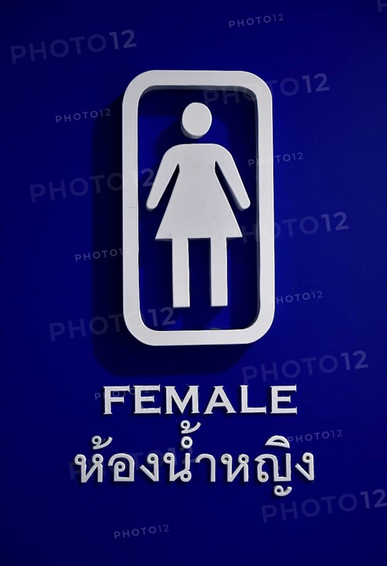 Female toilet sign in English and Thai script