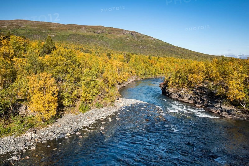 Abiskojokk river in autumnal landscape