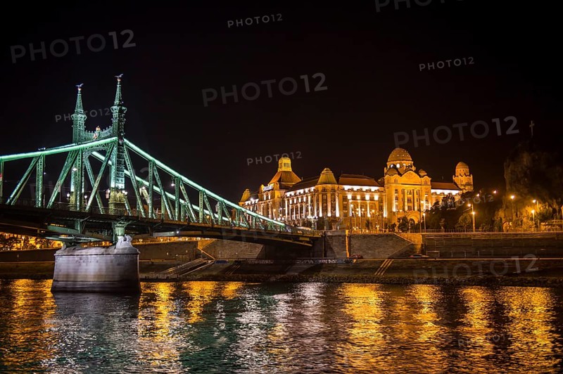 Illuminated bridge and the Gellert Hotel at night