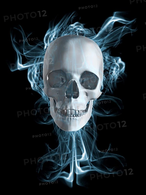 Human skull surrounded by smoke