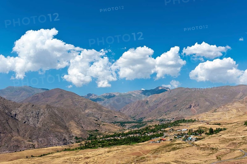 View of villages Koushk and Zavardasht in mountain landscape at Ovan Lake