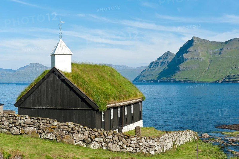 Old Faroese wooden church with a grass roof