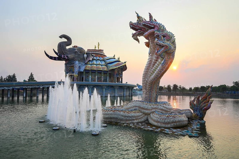 Seven-headed Naga serpent and fountain in front of the Elephant Temple Thep Wittayakhom Vihara