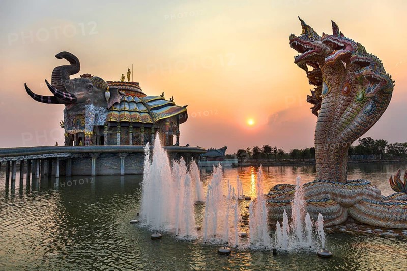 Seven-headed Naga serpent and fountain in front of the Elephant Temple Thep Wittayakhom Vihara