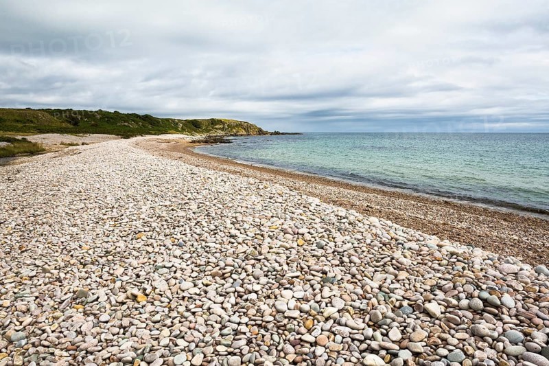 Pebble beach at end of Claggain Bay