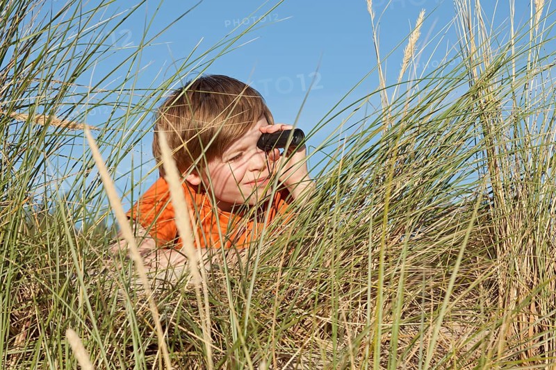 Boy in the dune grasses