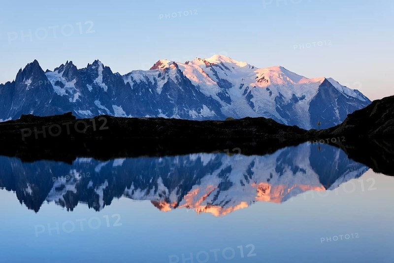 Mont Blanc massif at sunrise reflected in Lac de Chesserys