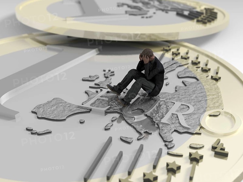 Man sitting on euro coin