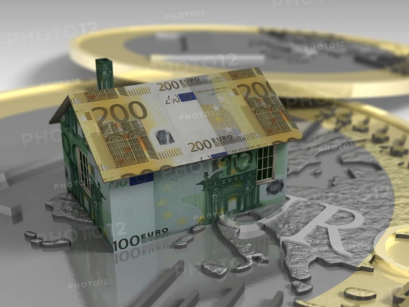 House made of euro banknotes on top of coin