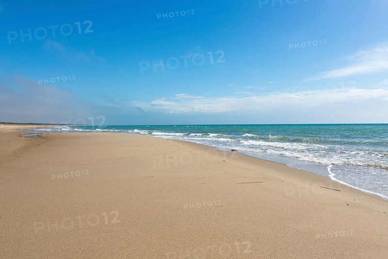 Empty sandy beach in Taranto
