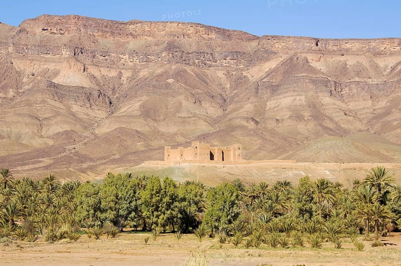 View of Tamnougalt Kasbah with the Djebel Kissane mountain ridge in the back