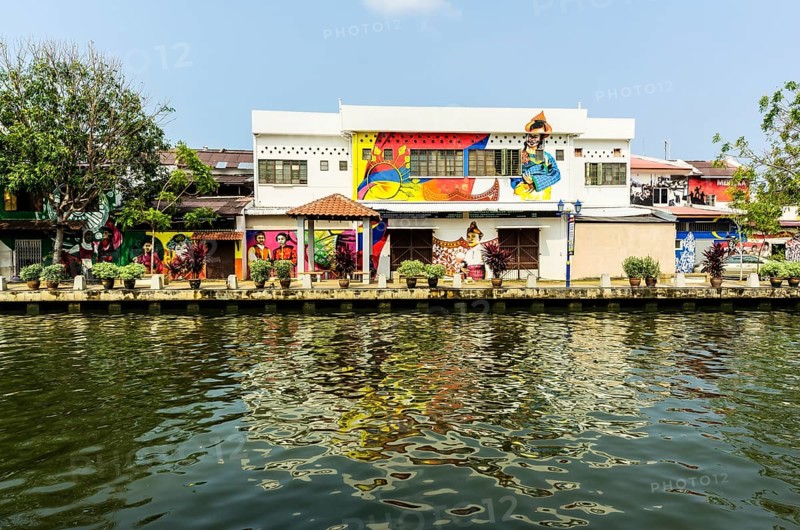 Brightly painted house fronts along the Malacca River