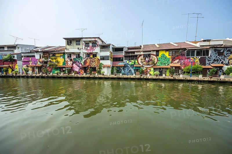Brightly painted house fronts along the Malacca River