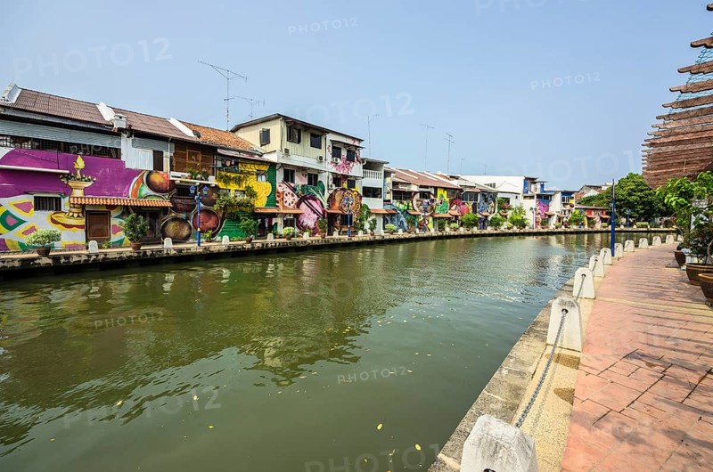 Brightly painted houses along the Malacca River