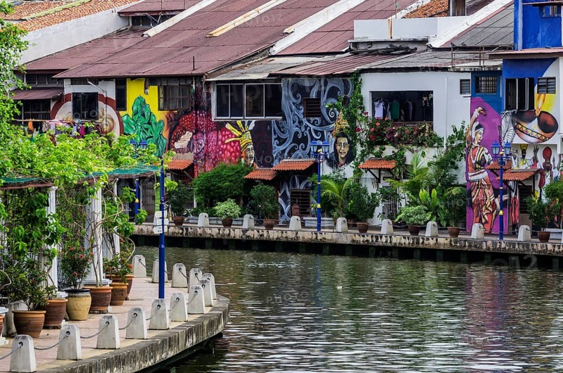 Brightly painted house fronts along the Malacca River
