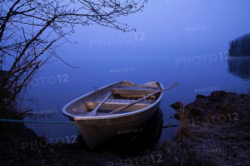 Rowboat on the bank of the lake