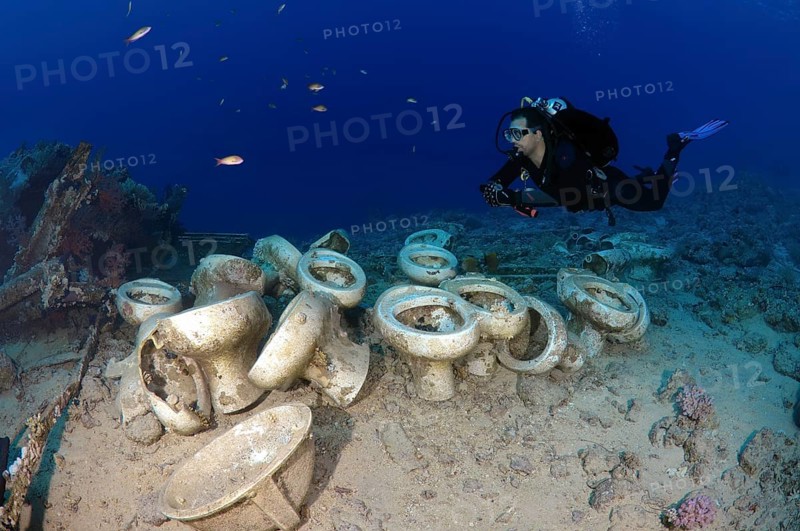 Diver looking at the plumbing on the shipwrecks in Ras Muhammad National Park