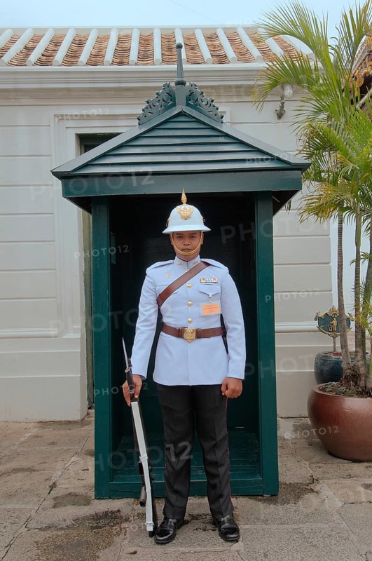 A soldier of the Royal Guards stands at the entrance of the Grand Palace