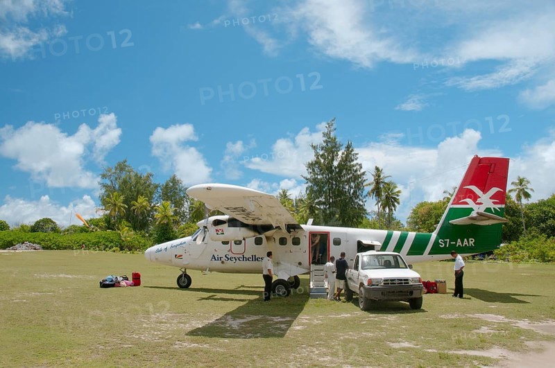 A small plane of Seychelles airlines on the runway