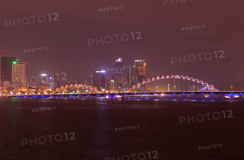 Illuminated Cáº§u Rá»“ng or dragon bridge over the Han River at night