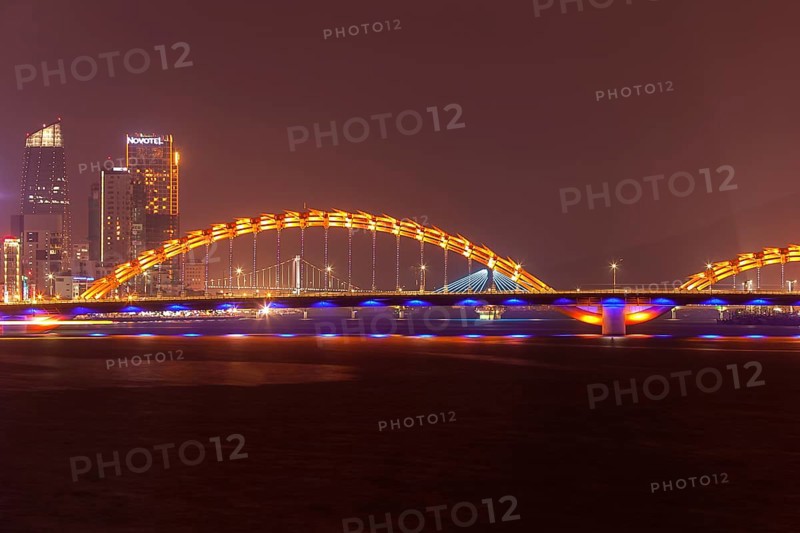 Illuminated Cáº§u Rá»“ng or dragon bridge over the Han River at night